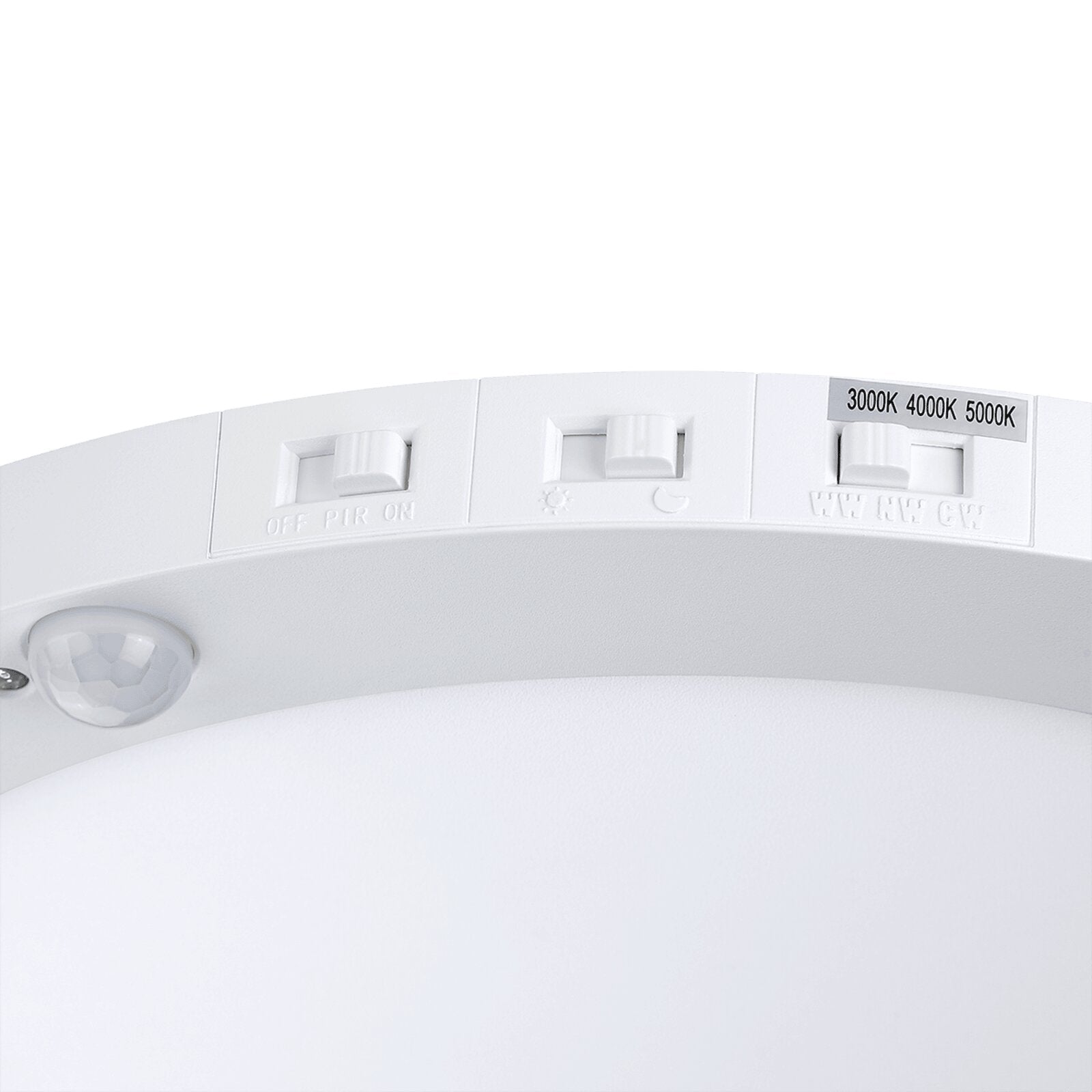 close view of the ceiling flush mount light with 3 switches for CCT, motion sensor and dusk to dawn