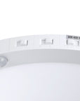 close view of the ceiling flush mount light with 3 switches for CCT, motion sensor and dusk to dawn