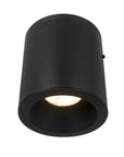 the bottom view of the 4.5" matte black cylinder LED flush mount ceiling light with light on